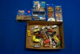 Box of assorted Hot Wheels-1-Planet Micro, 1-Haulers, 1-Action Pack, 2-5 packs, 30-loose units