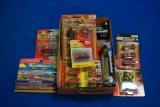 Box of assorted diecast Fire/Rescue Vehicles, Figurines & a Squirt Gun