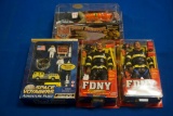 Box of 4-Firefighter Figurines w/2-FDNY Am. Bravest 1-Space Voyagers & 1-Crawling Firefighter