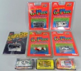 Grouping of Eight Slot Car Racers in Original Packaging