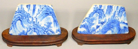 Two Trapezoid-Shaped Blue and White Tiles on Wooden Stands