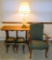 Grouping of Upholstered Armchair, Sofa Table, Lamp, Two Stools