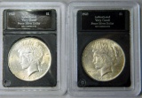 Two (2) U.S. Peace Silver Dollar Coins, Slabbed