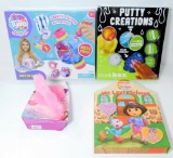 Assorted Toys Including Dora the Explorer, Pomsies, Tie-Dye, Putty