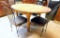 Wooden Dining Table with Four Black Metal Chairs