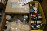 2 boxes of paints and cleaners