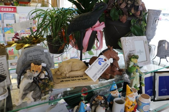 Shelf of ceramic stones, animals, picture frames, misc.