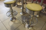 7 swivel padded chrome base stools - will need removed from floor