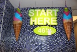 Start here sign & 2 blow up cones