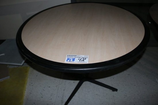 42" Round blond Formica top & black edge table
