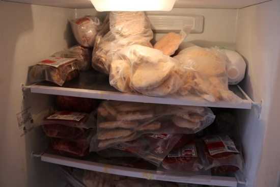 Assorted food in freezer, smoked ham, roast beef, corn beef, hamburger
