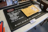 Genuine Parts pricing board with extra letters