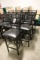 Times 7 - Black metal ladder back framed chairs with black vinyl padded sea