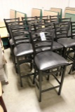 Times 7 - Black metal ladder back framed chairs with black vinyl padded sea