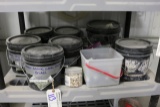 Shelf of assorted glass pellets, rocks, misc.