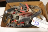 Box of oil wrenches and hand clamps