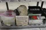 Shelf with first aid kit, knee pads, contractor clean up bags