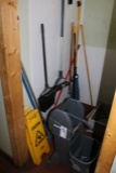 Mop bucket, brooms, misc. in closet