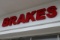 LED Lighted newer Brakes sign above bay door - Buyer to remove