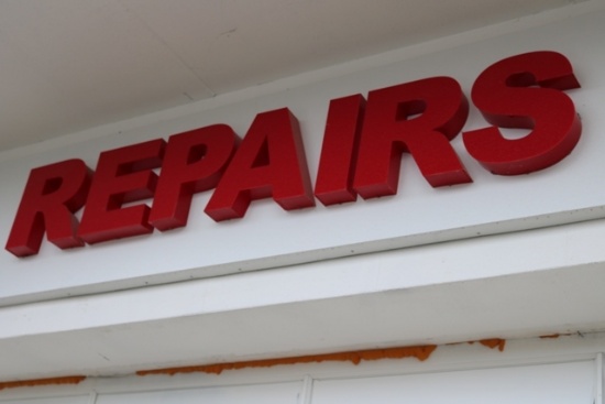 LED Lighted newer Repair sign above bay door - Buyer to remove