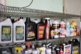 Shelf of open automotive oils & supplies
