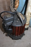 Sump pump in barrel with hose