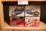 All to go - 4 AMT model cars - new in box