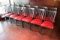 Times 14 - Black metal slat back dining chairs with burgundy vinyl seats