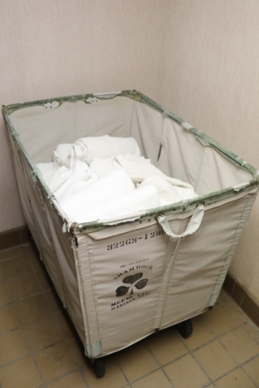 Laundry cart loaded with towels, hand towels and wash rags