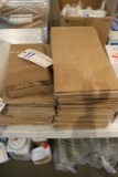 2 Piles of brown paper sacks
