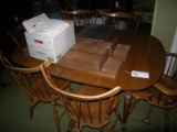 Windsor style Maple table 6 chairs and leaves & box of tablecloths