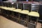 Times 8 - Polished metal ladder back bar chairs with olive green vinyl seat