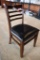 Times 12 - walnut stained dining chairs with slat backs and black padded se