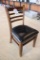 Times 12 - walnut stained dining chairs with slat backs and black padded se