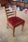 Times 7 - Wood slat back dining chairs with red padded seats