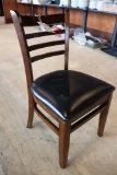 Times 12 - walnut stained dining chairs with slat backs and black padded se