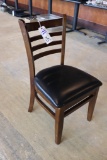 Times 5 - walnut stained dining chairs with slat backs and black padded sea