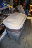 All to go - 4 Rubbermaide 50 gallon totes with lids