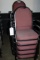 Times 11 - Black metal framed burgundy tweed stack chairs with arm rests