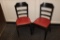 Times 4 - Black wood framed ladder back dining chairs with marron vinyl se