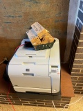 HP Color Laser Jet CP2025 Printer with some ink cartridges