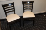 Times 20 - Black wood framed ladder back dining chairs with tan vinyl seats
