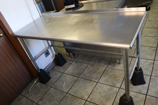 24" x 60" Stainless table with 1.5" backsplash & leg risers - top has 6 sma