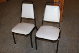 Times 24 - Black metal framed & light gray vinyl stack chairs