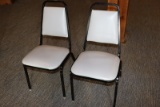 Times 24 - Black metal framed & light gray vinyl stack chairs