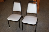 Times 24 - Black metal framed & light gray vinyl stack chairs
