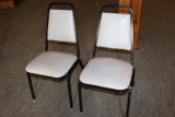 Times 24 - Black metal framed & light gray vinyl stack chairs