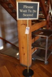 Please wait to be seated sign/stand