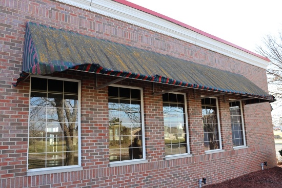 4' x 25' long aluminum framed awning - as is material on awning - buyer to