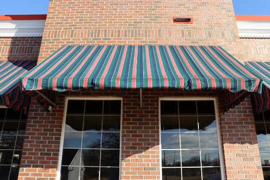 4' x 12' long aluminum framed awning - as is material on awning - buyer to